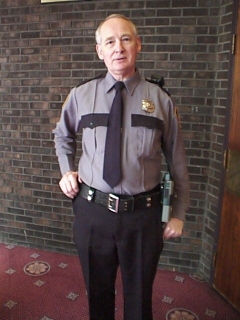 John Henley,Wardrobe: Casino Security Guard