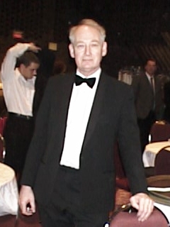 John Henley,Wardrobe: Modern black tuxedo